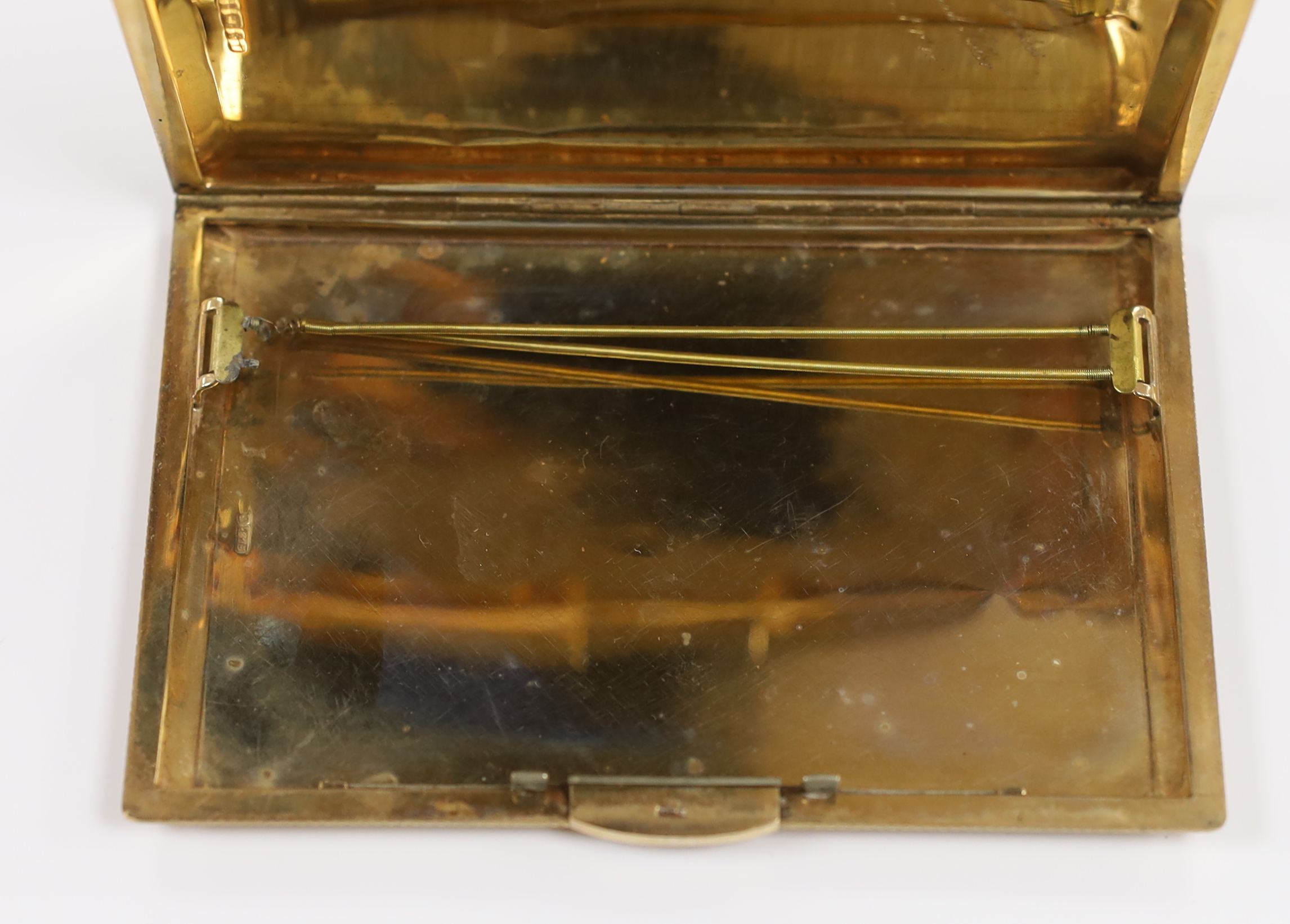 A 1940's engine turned 9ct gold cigarette case, with interior engraved inscription, 12.4cm, gross weight 171.2 grams.